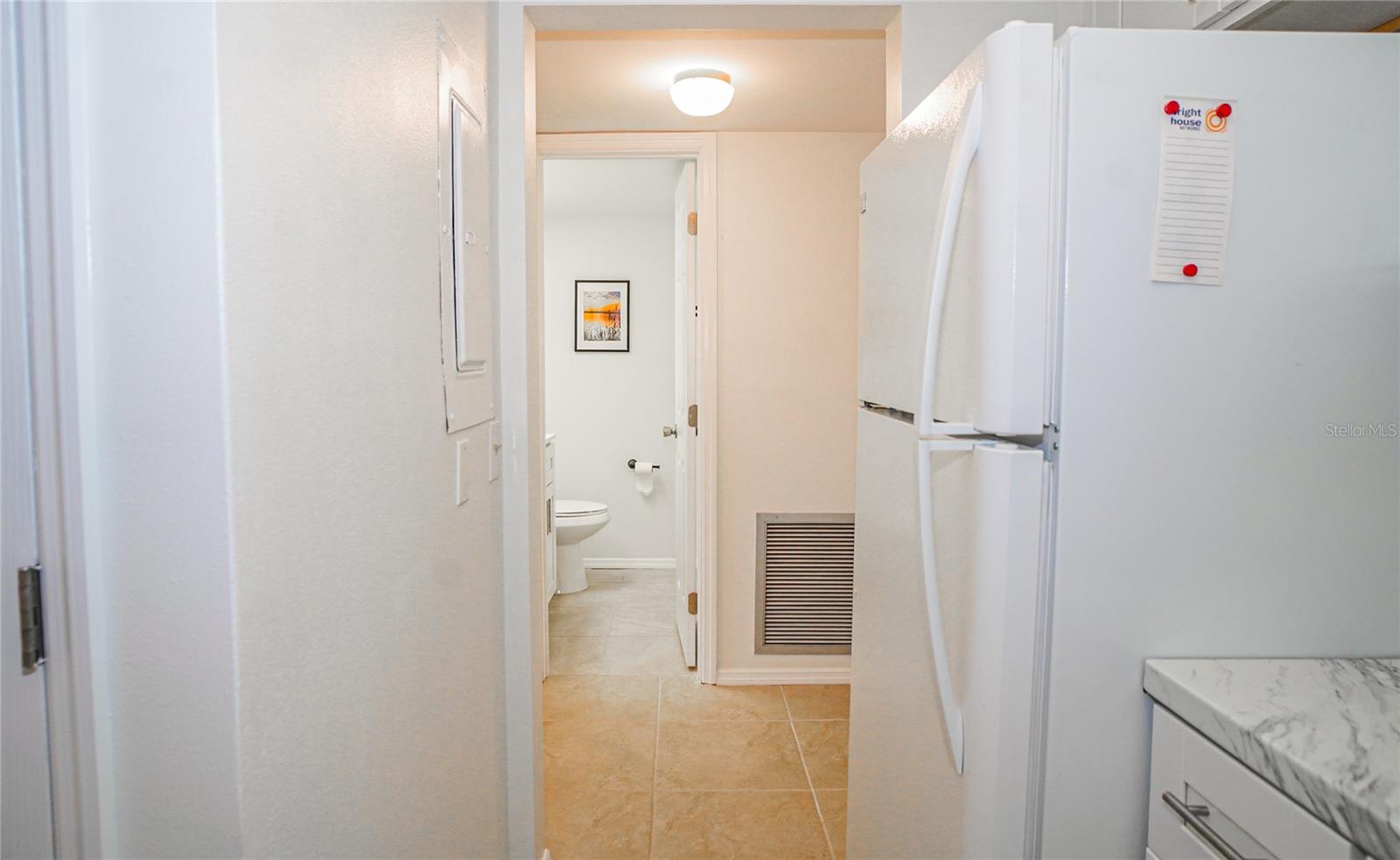 From Kitchen to main hall and half bath