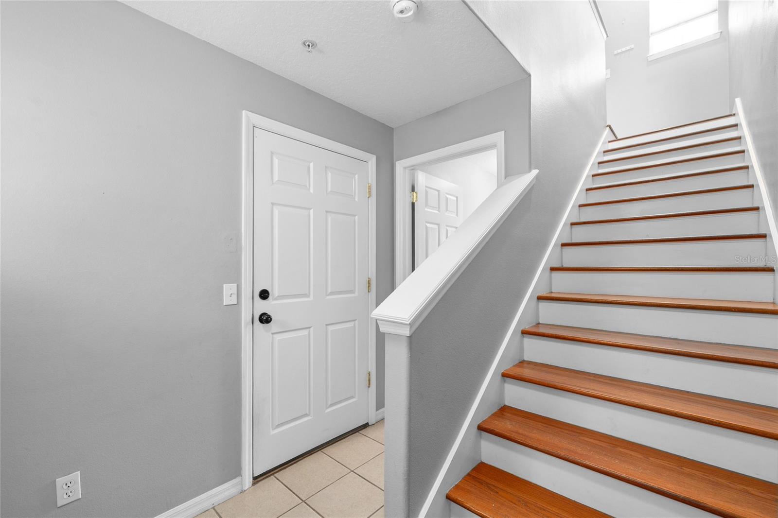 Floor 1: Entrance foyer, garage access, door to laundry & backyard