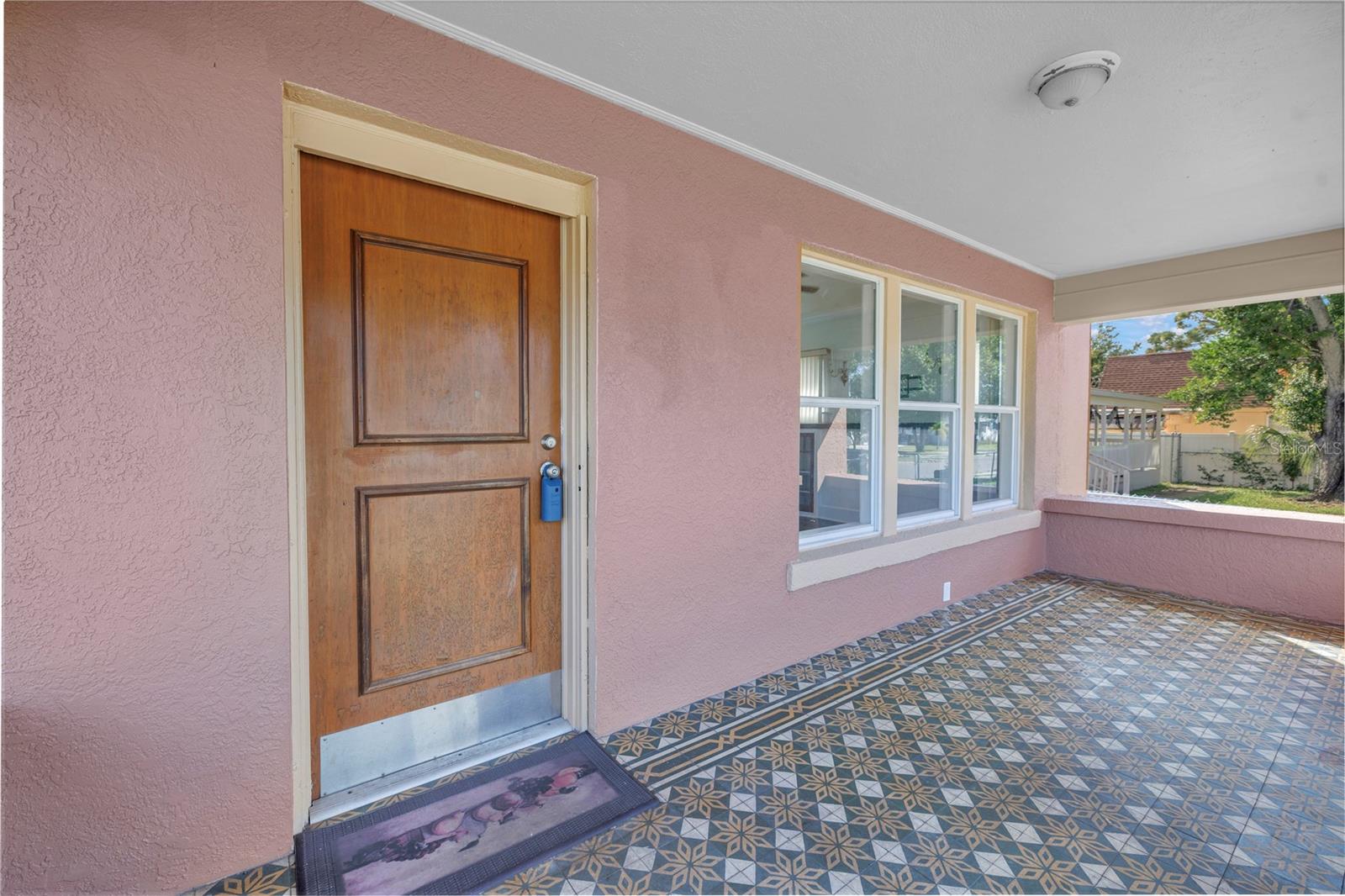 BEAUTIFUL TILE ON LARGE FRONT PORCH