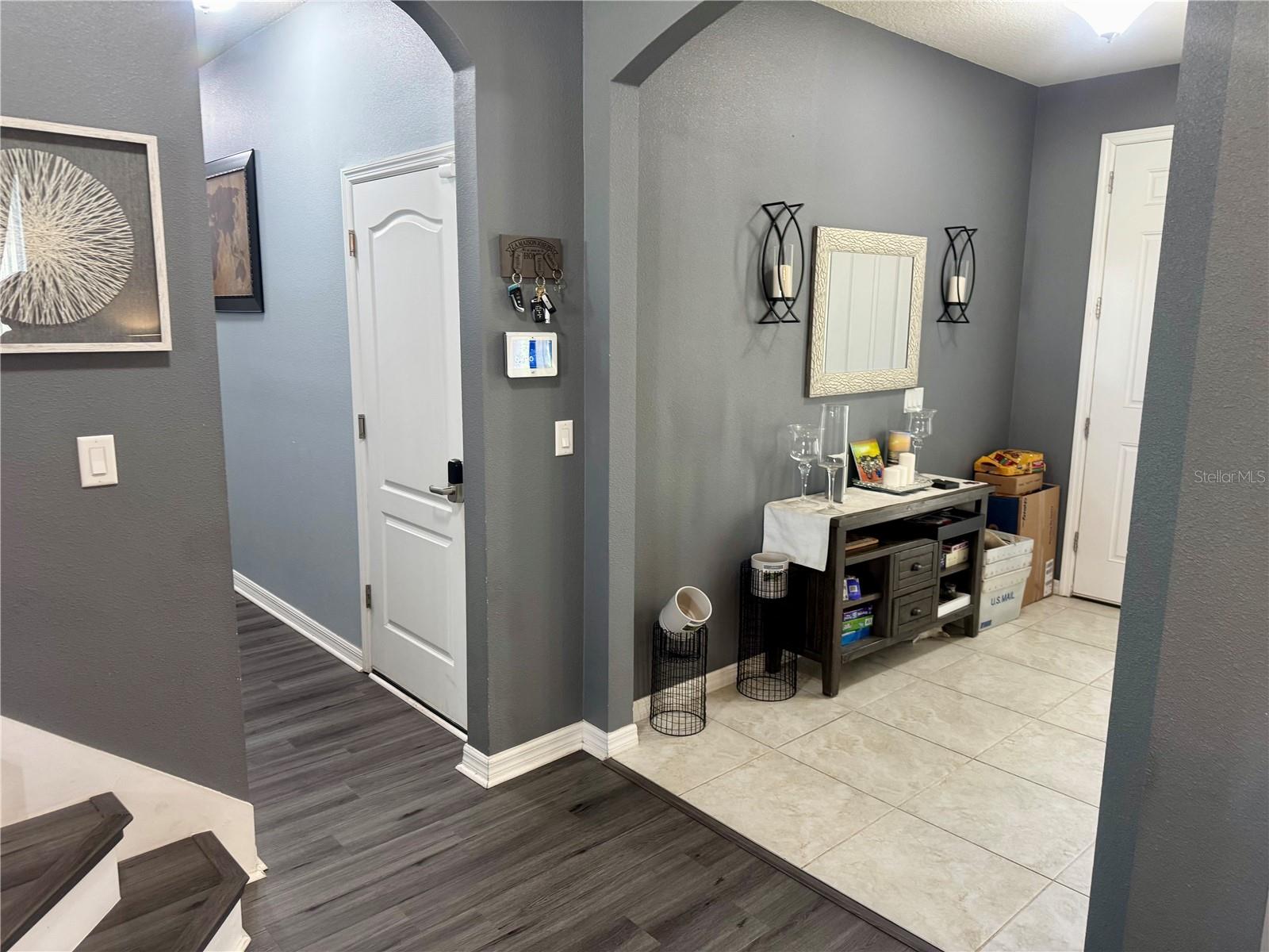 Entry and hall to downstairs bedroom & 1/2 bath