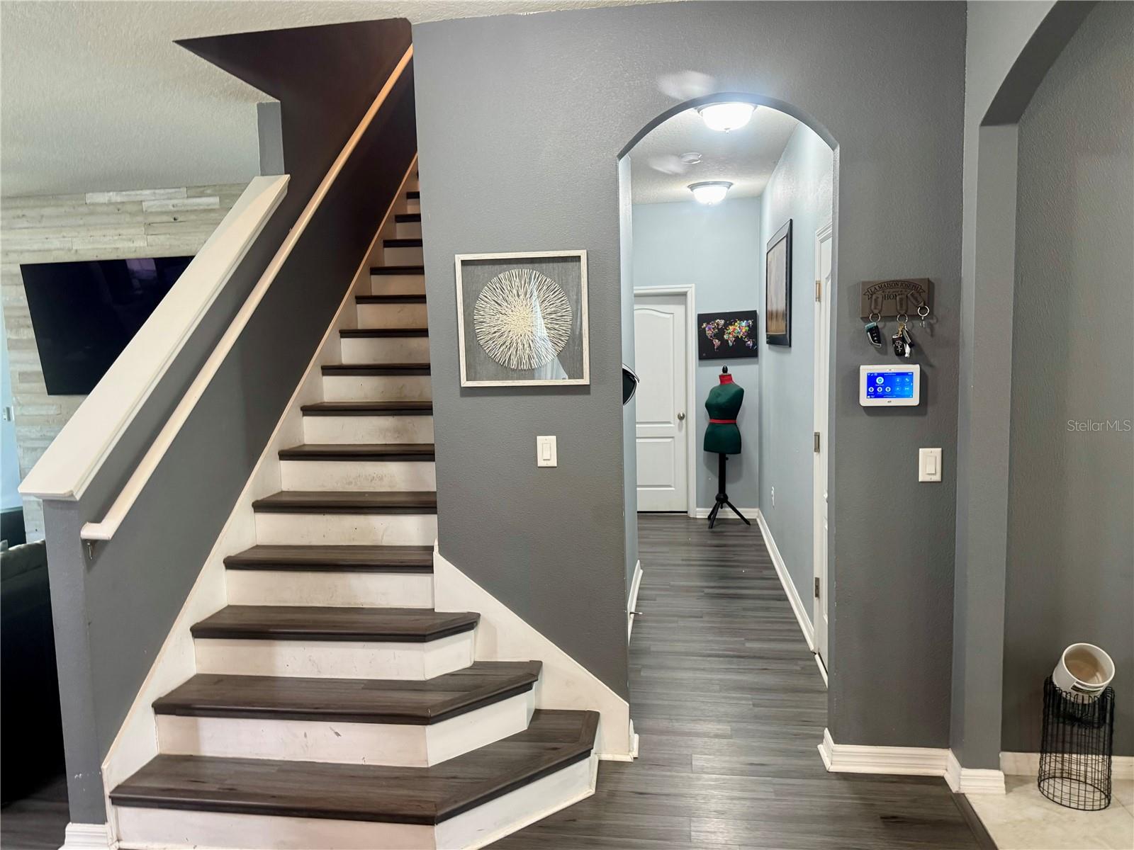 Hall to downstairs bedroom and 1/2 bath