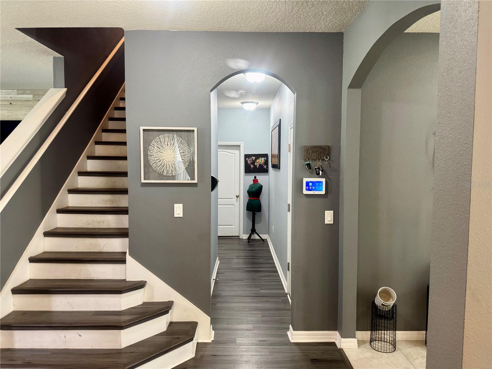 Hall to downstairs bedroom and 1/2 bath