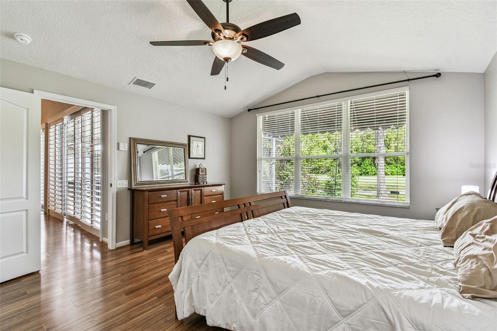 Comfortable and spacious Primary Bedroom with large windows