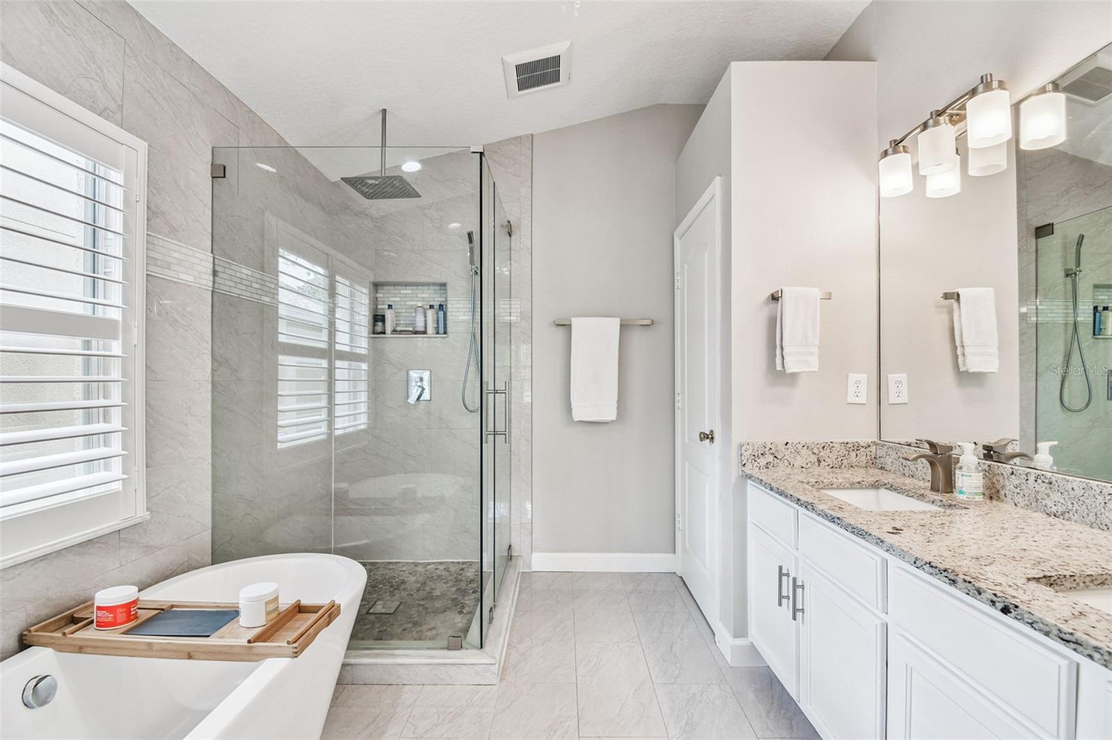 Stunning Primary bath with freestanding tub, waterfall showerhead