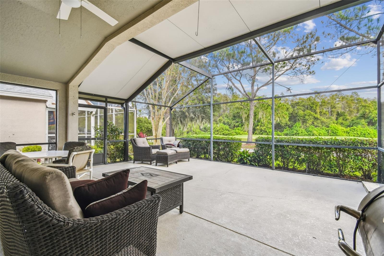 Spacious covered lanai with ceiling fans and outlets