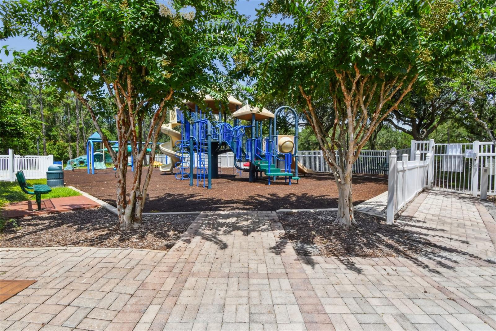 Gate secured playground with shade