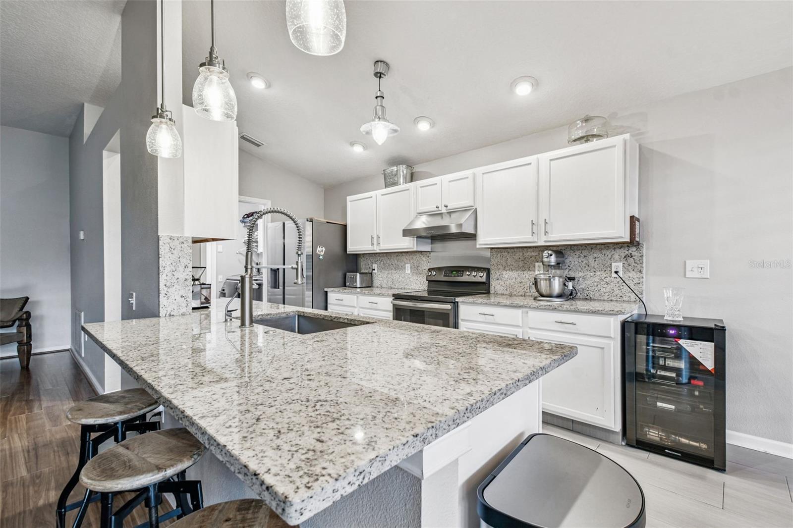 Granite countertops, designer pendant lighting