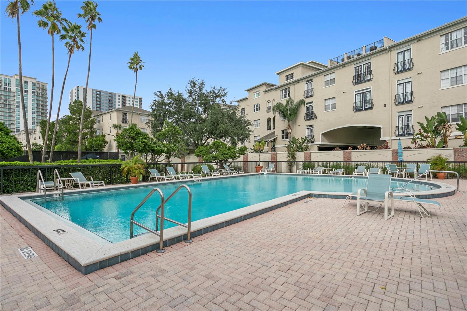 The community pool offers ample seating with plenty of lounge chairs to relax and soak up the Florida sunshine.