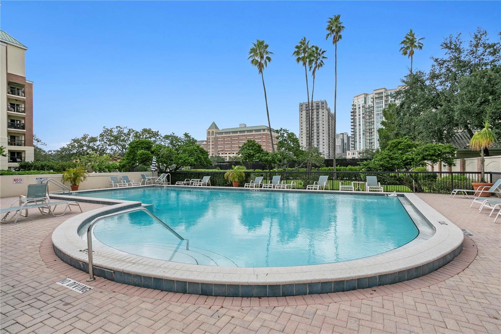 The community pool offers ample seating with plenty of lounge chairs to relax and soak up the Florida sunshine.