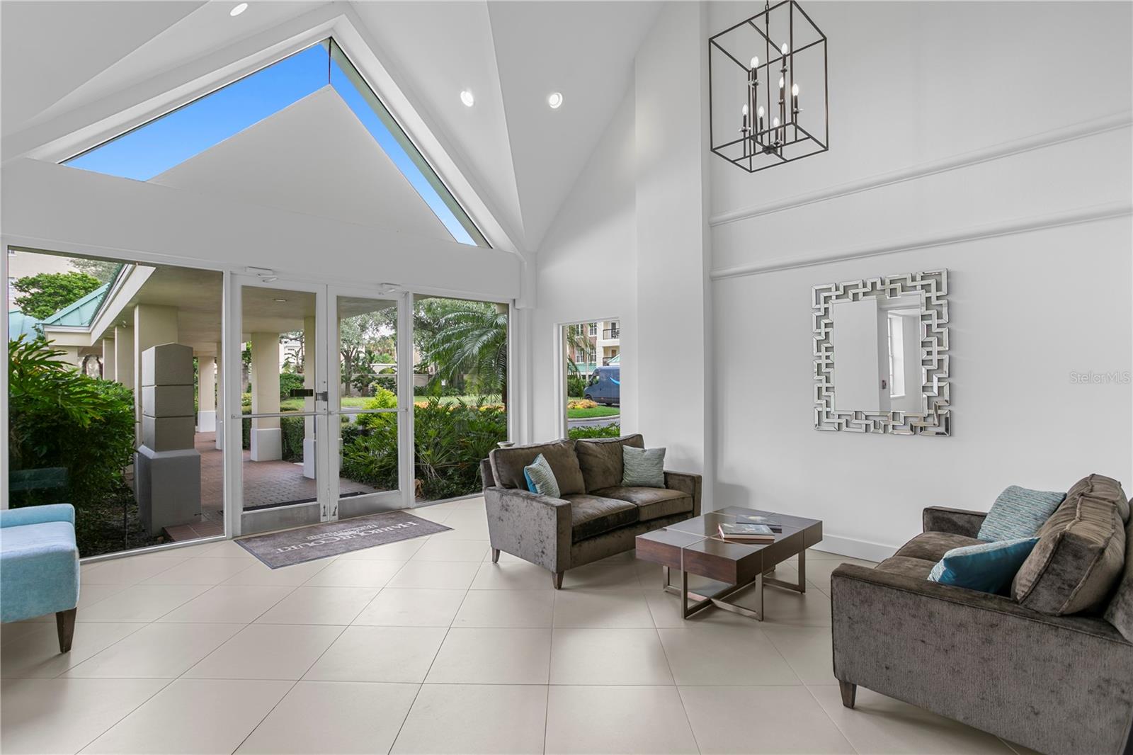 The condominium lobby welcomes you with abundant natural light and comfortable seating areas.