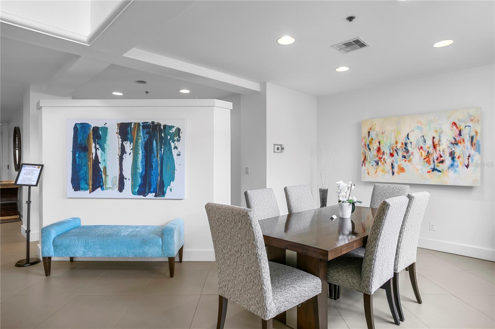 The condominium lobby welcomes you with abundant natural light and comfortable seating areas.