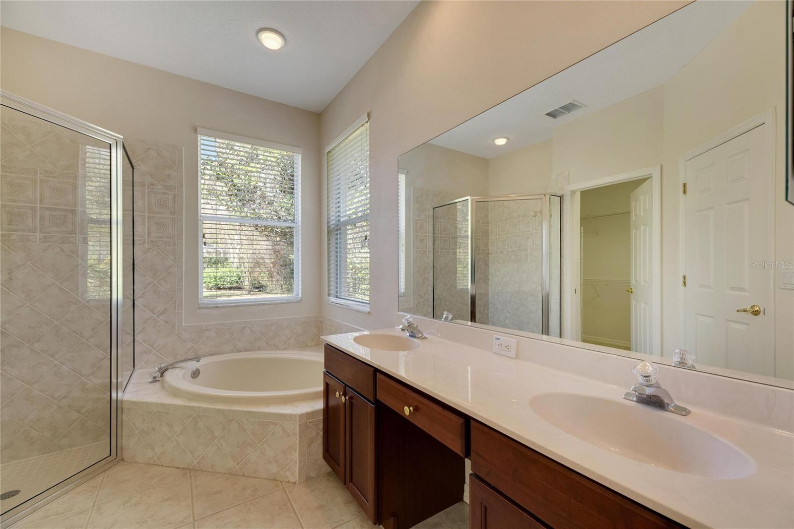 Primary Bath. Double sinks, garden tub, step in shower.