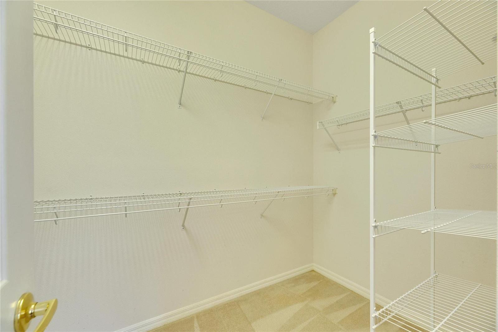 Primaryr Bedroom walk in closet.