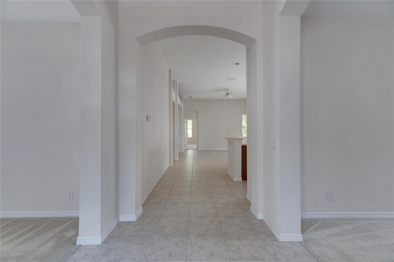 View fro the front door foyer.  Living room to the left, dining room to the right.