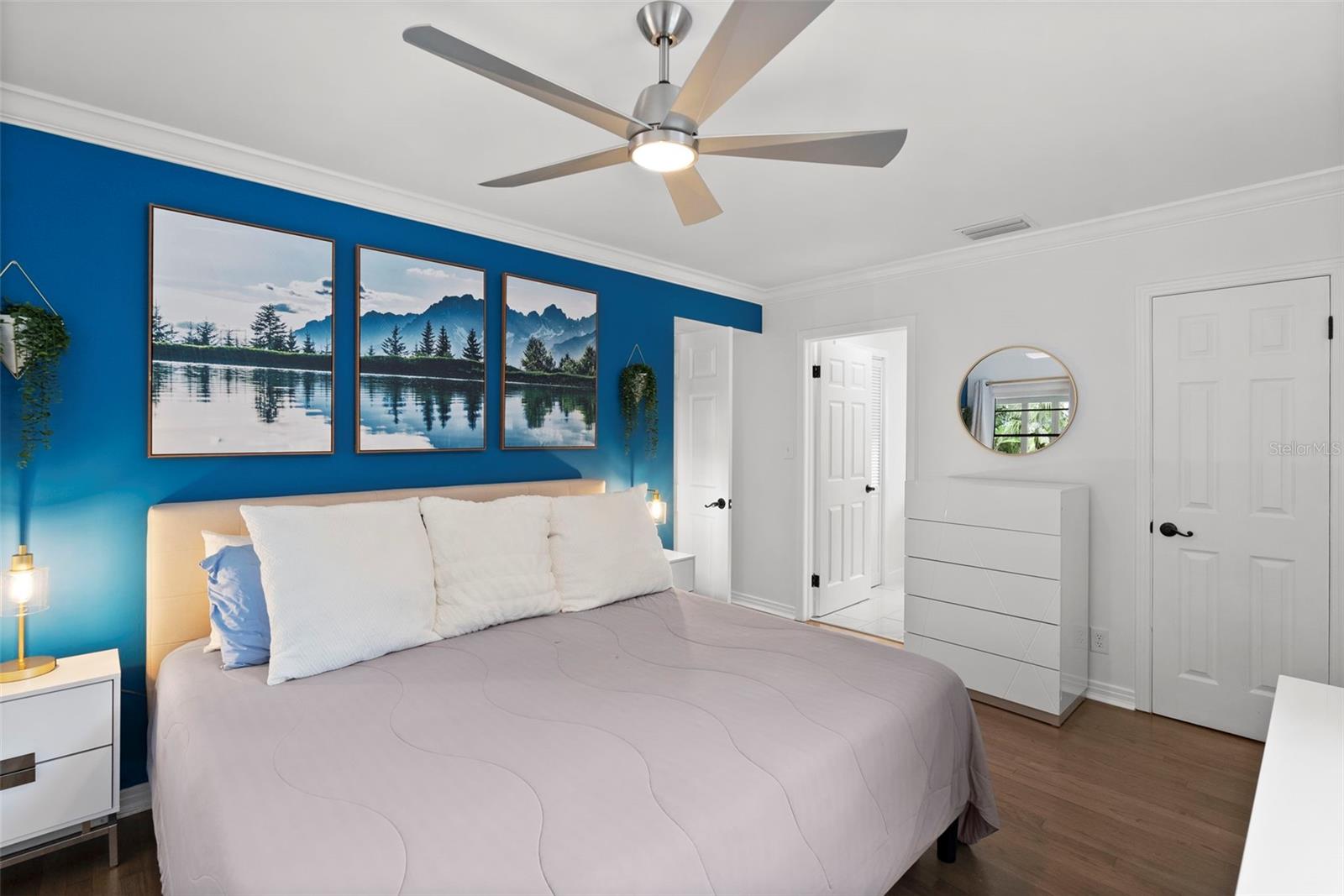 primary bedroom with hardwood floors