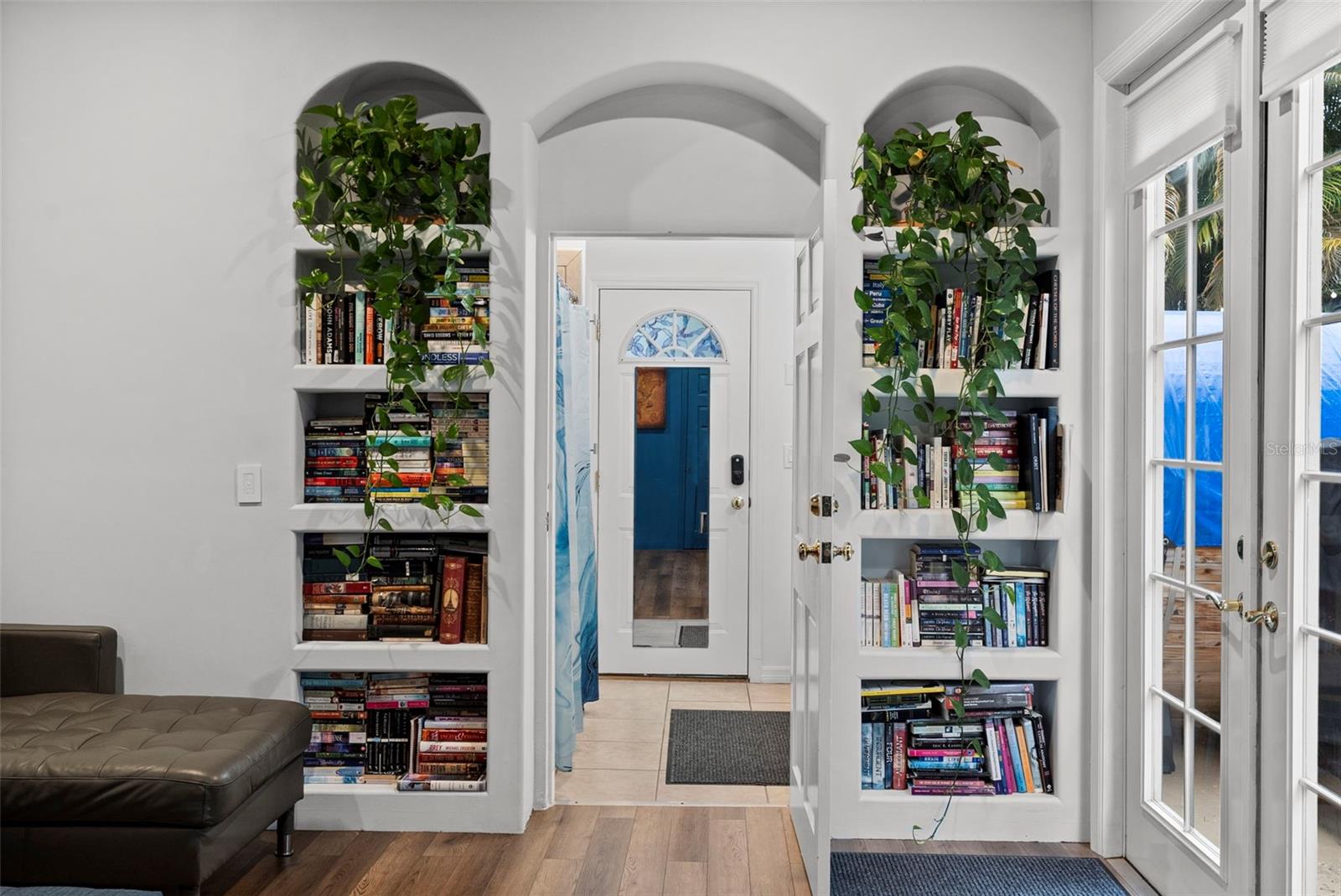 built-in shelving with arched detailing