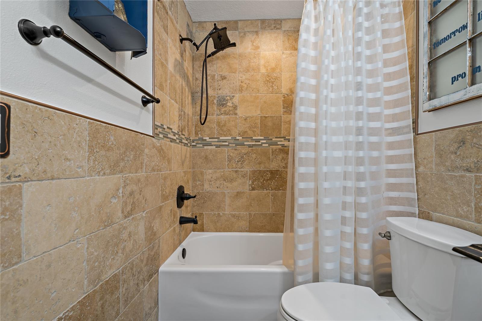 SHOWER/TUB COMBO IN THE GUEST BATHROOM