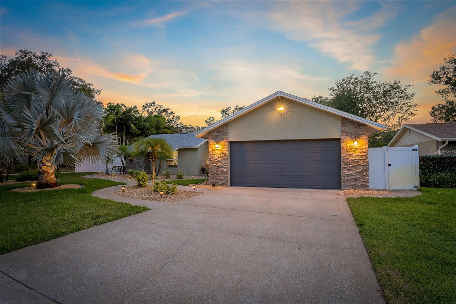 SPACIOUS DRIVEWAY & TWO CAR GARAGE!
