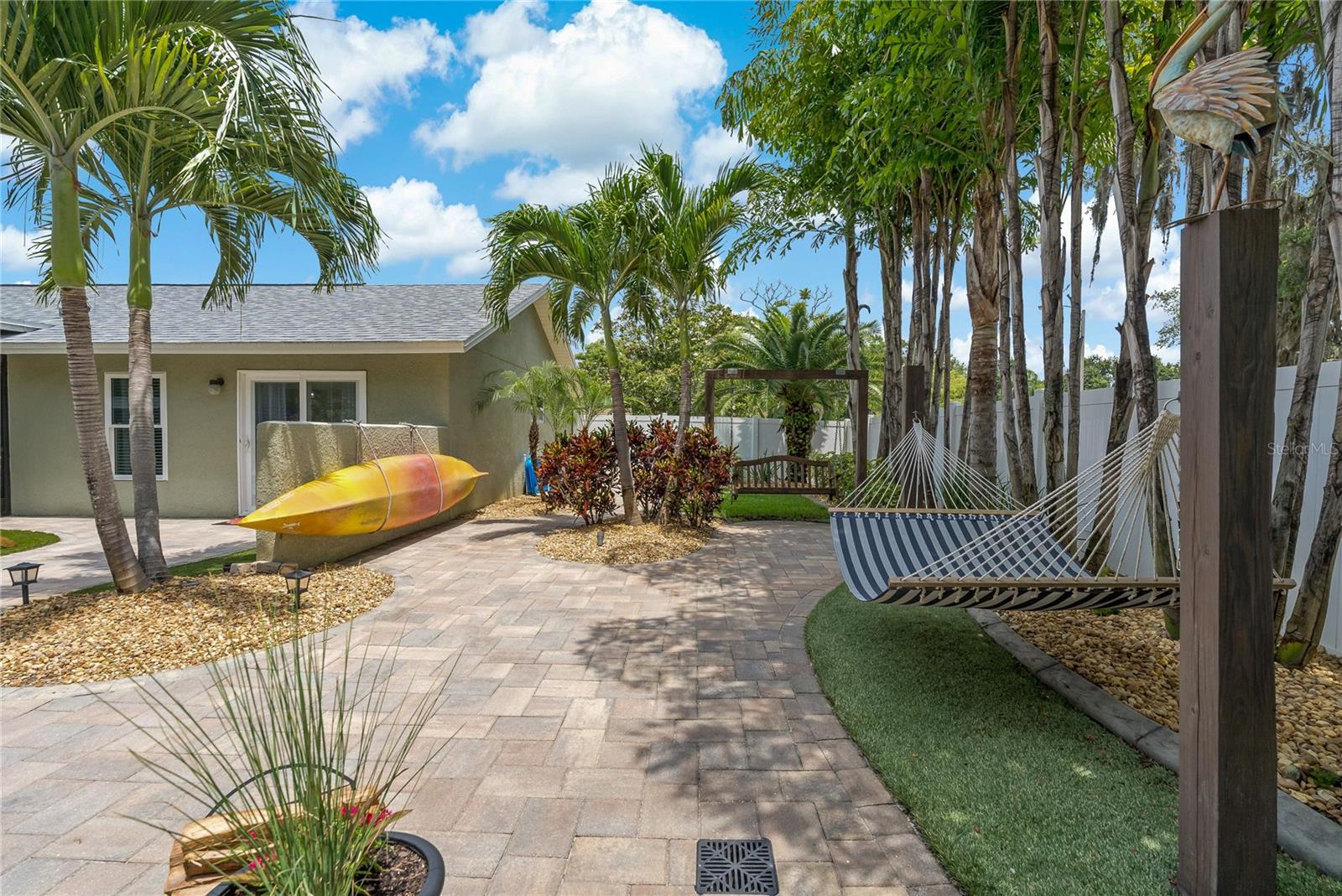 BRICK PAVER WALK WAYS MEANDER THROUGH THE FRONT AND BACK YARD!