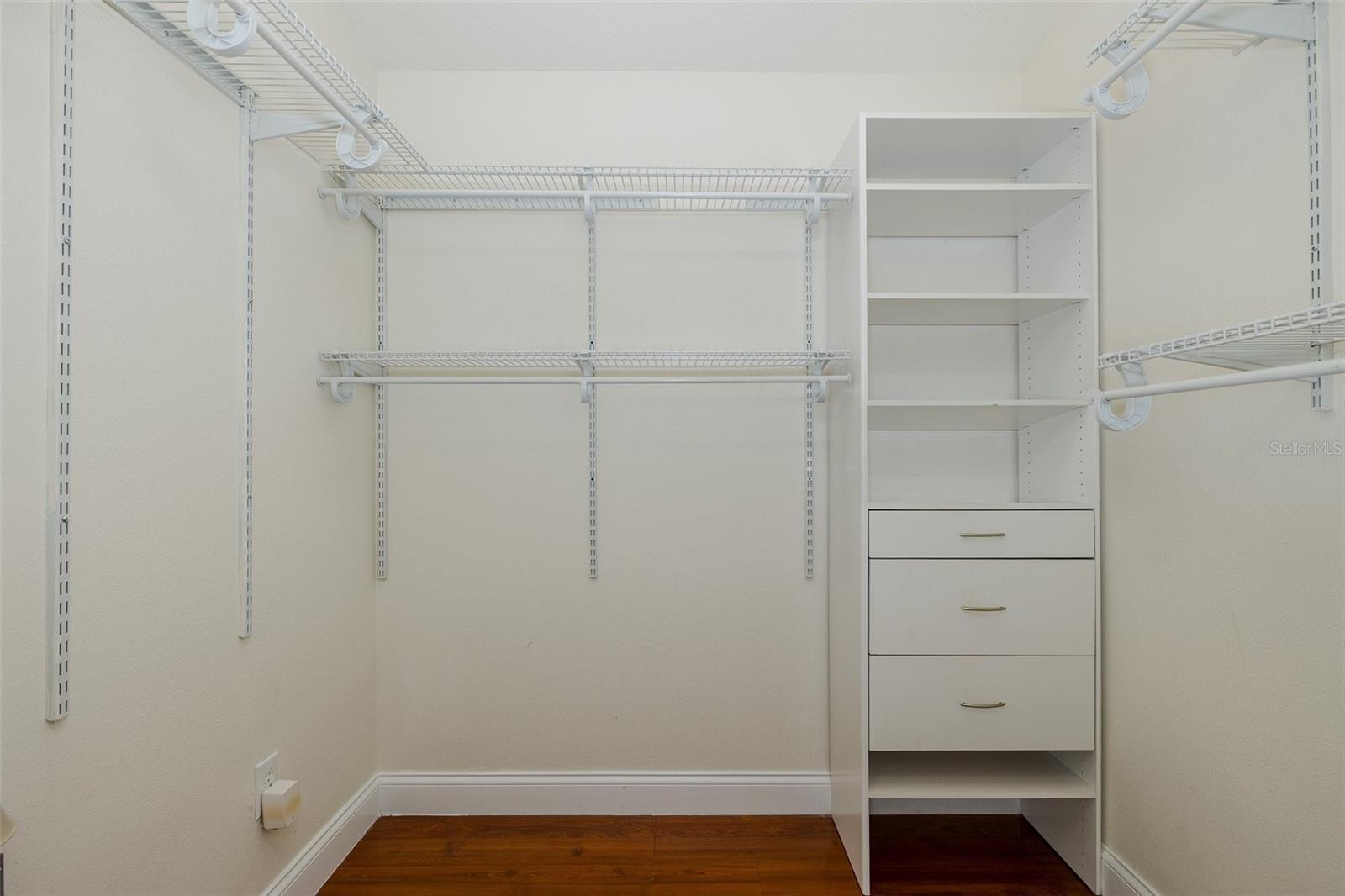 Walk in closet primary bedroom