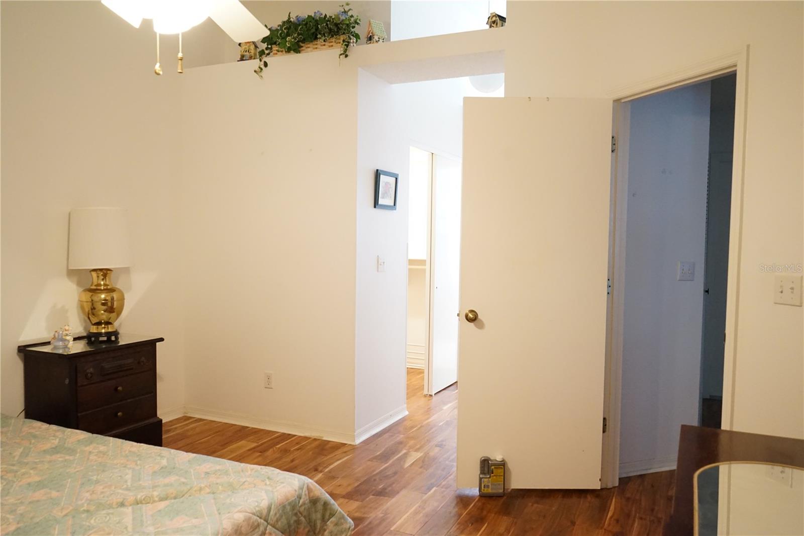 owners bedroom has high ceilings and plant shelf