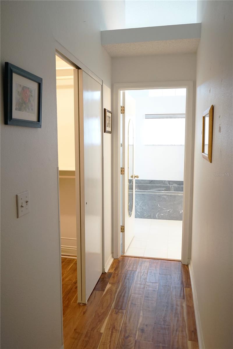 hallway to closet and bathroom