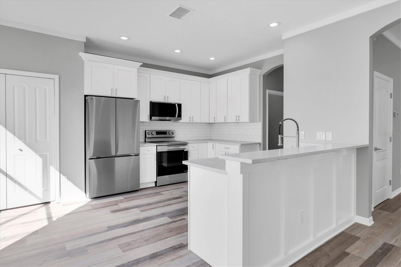 Kitchen with new cabinets and stone countertops