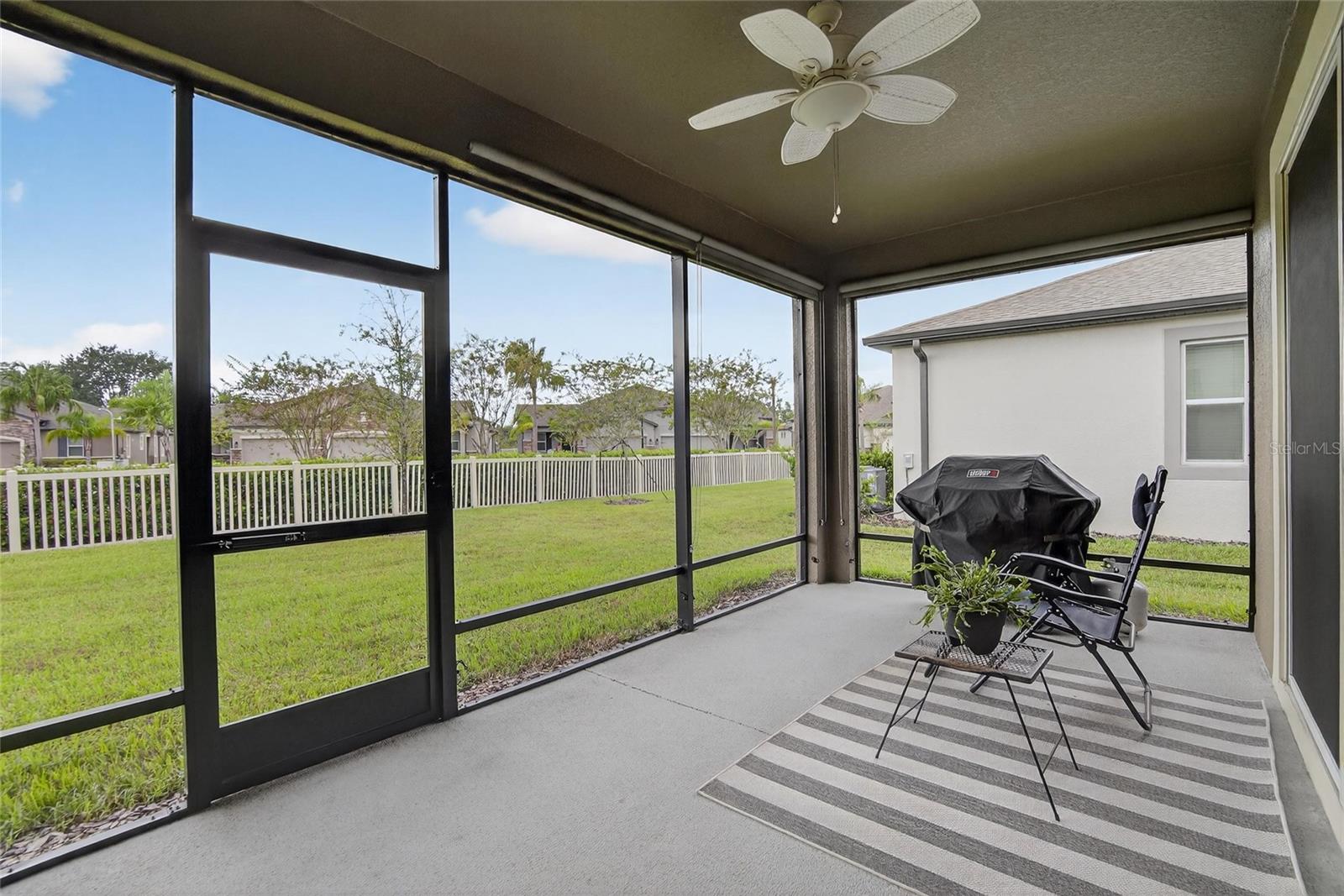 screened in porch with solar retractable shades