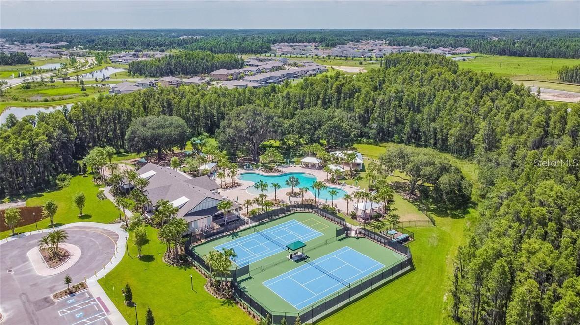 Aerial shot of the community tennis courts and pool