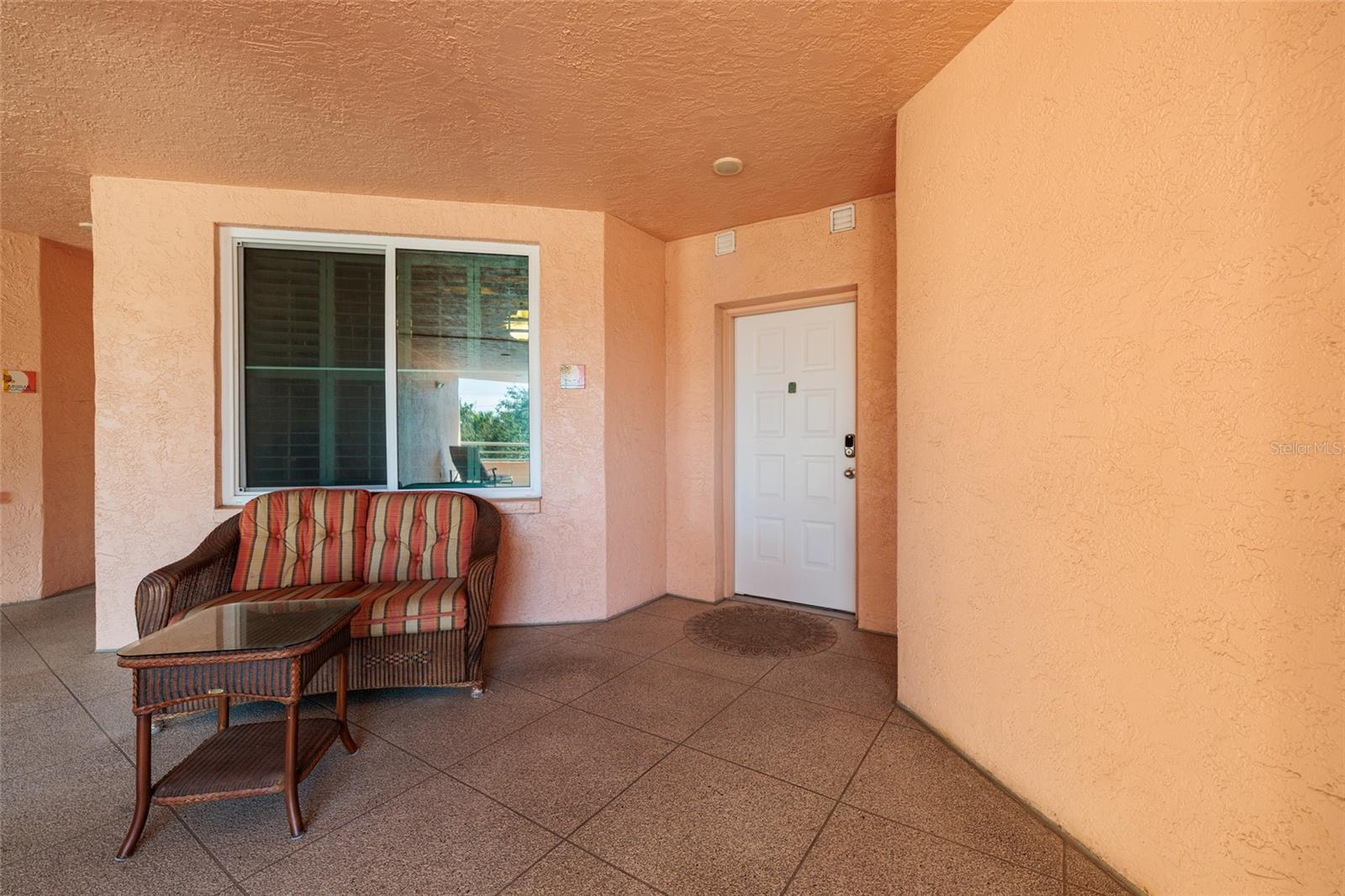 #205 Front entrance off the large outside foyer. Only 2 units on this side of the bldg.