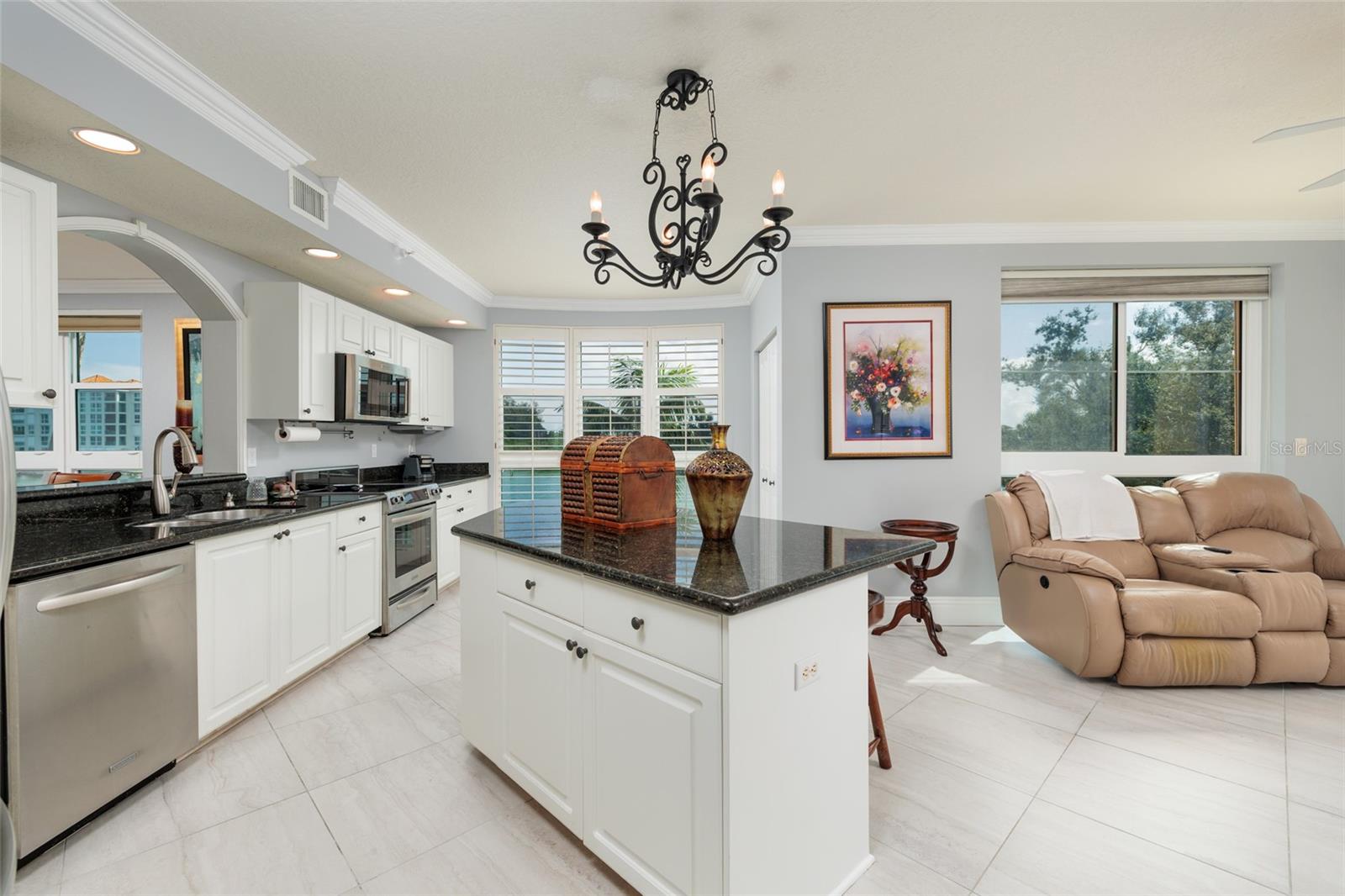 Kitchen w/Granite counters, crown molding & views of the intracoastal waterway.
