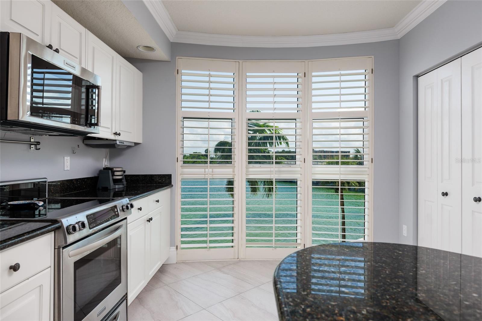 2023 High Impact Bay windows w/views of the intracoastal waterway. Pantry on right.