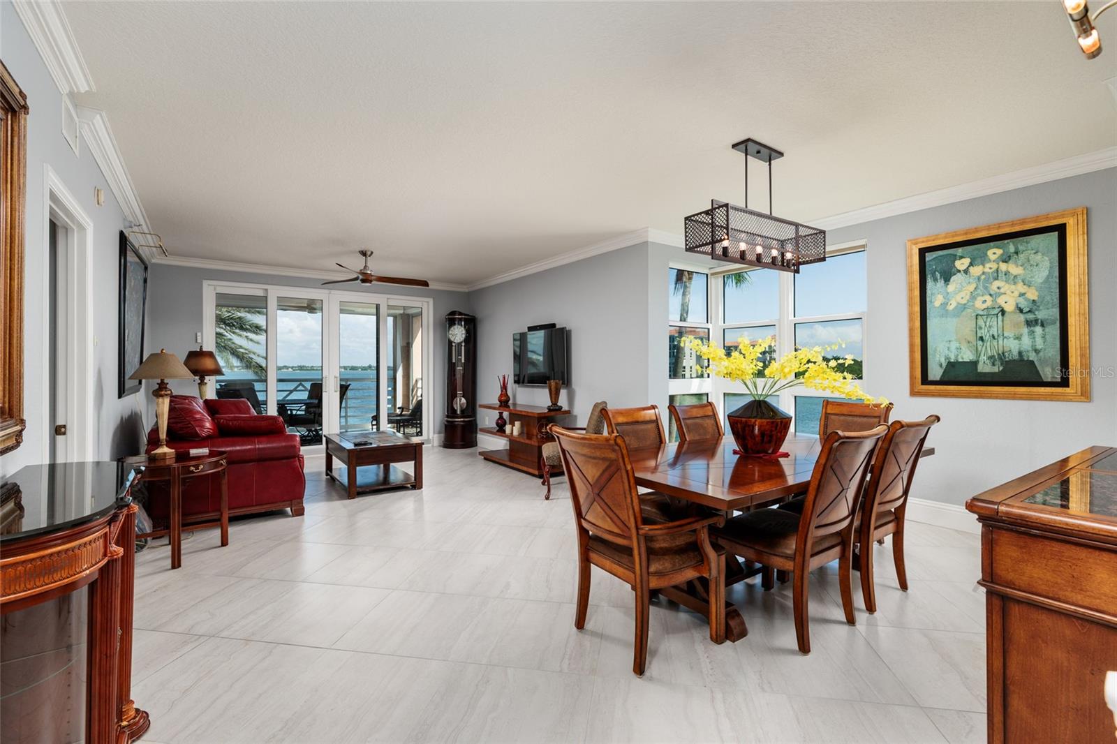 Dining/Living area w/views of Boca Ciega Bay. 24x24 Porcelain tile & crown molding.