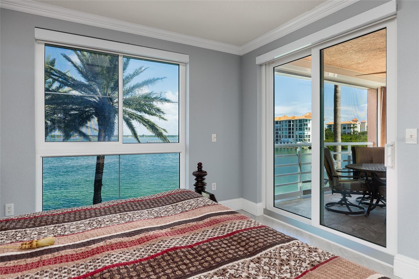 Primary bedroom w/Bay views & back balcony access.