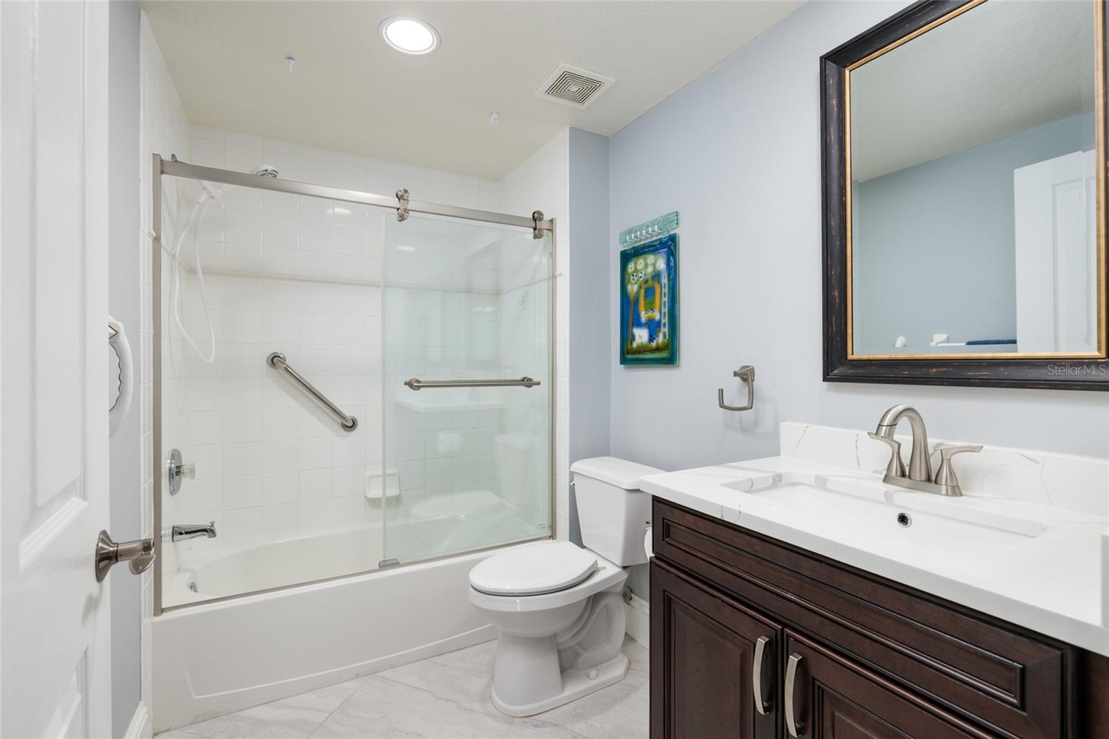 2nd bathroom (updated) w/granite counter & linen closet.