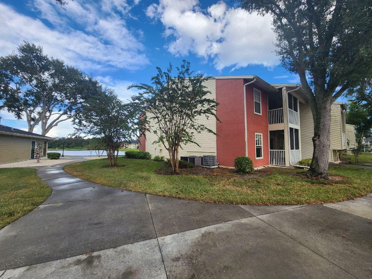 right next to clubhouse, fitness center entry door, and pool.