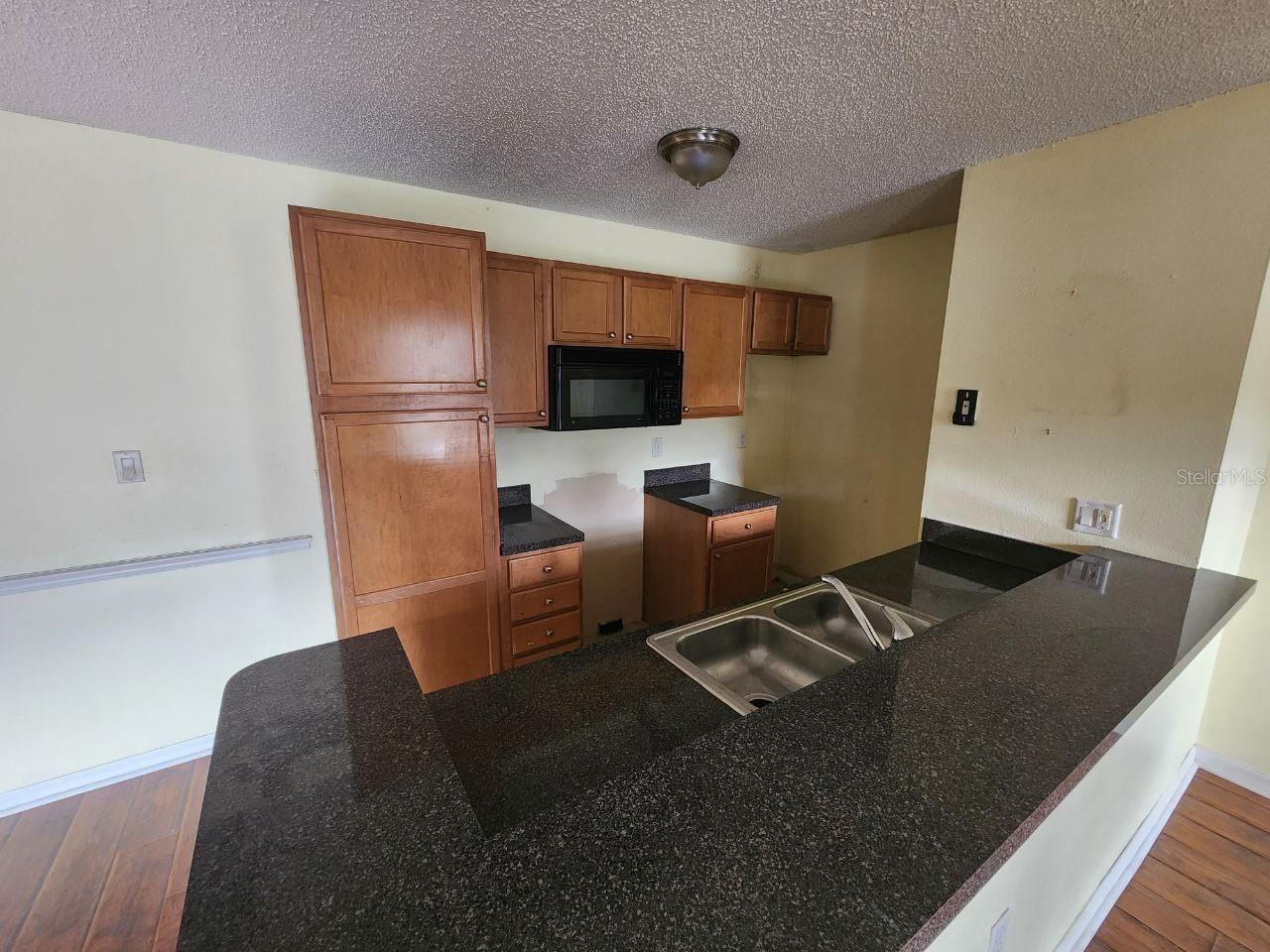 Kitchen w/ 2 Pantries.