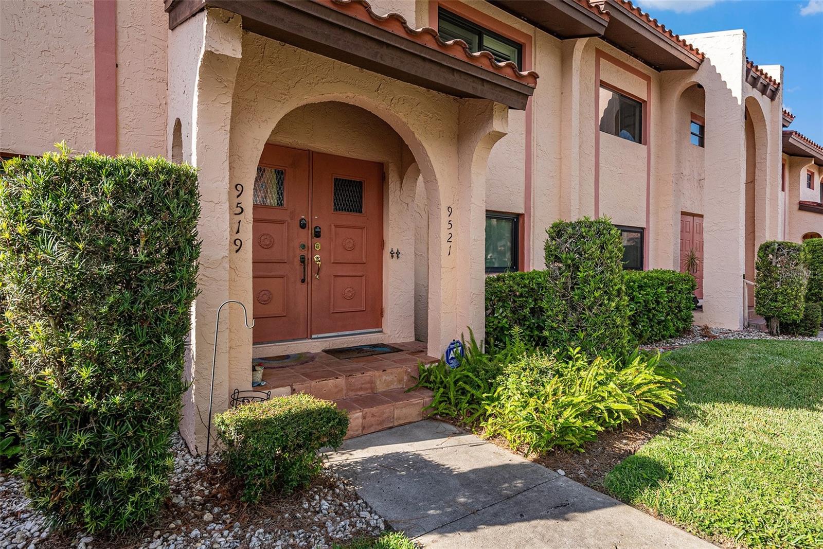 Front of building, unit entrance on the right