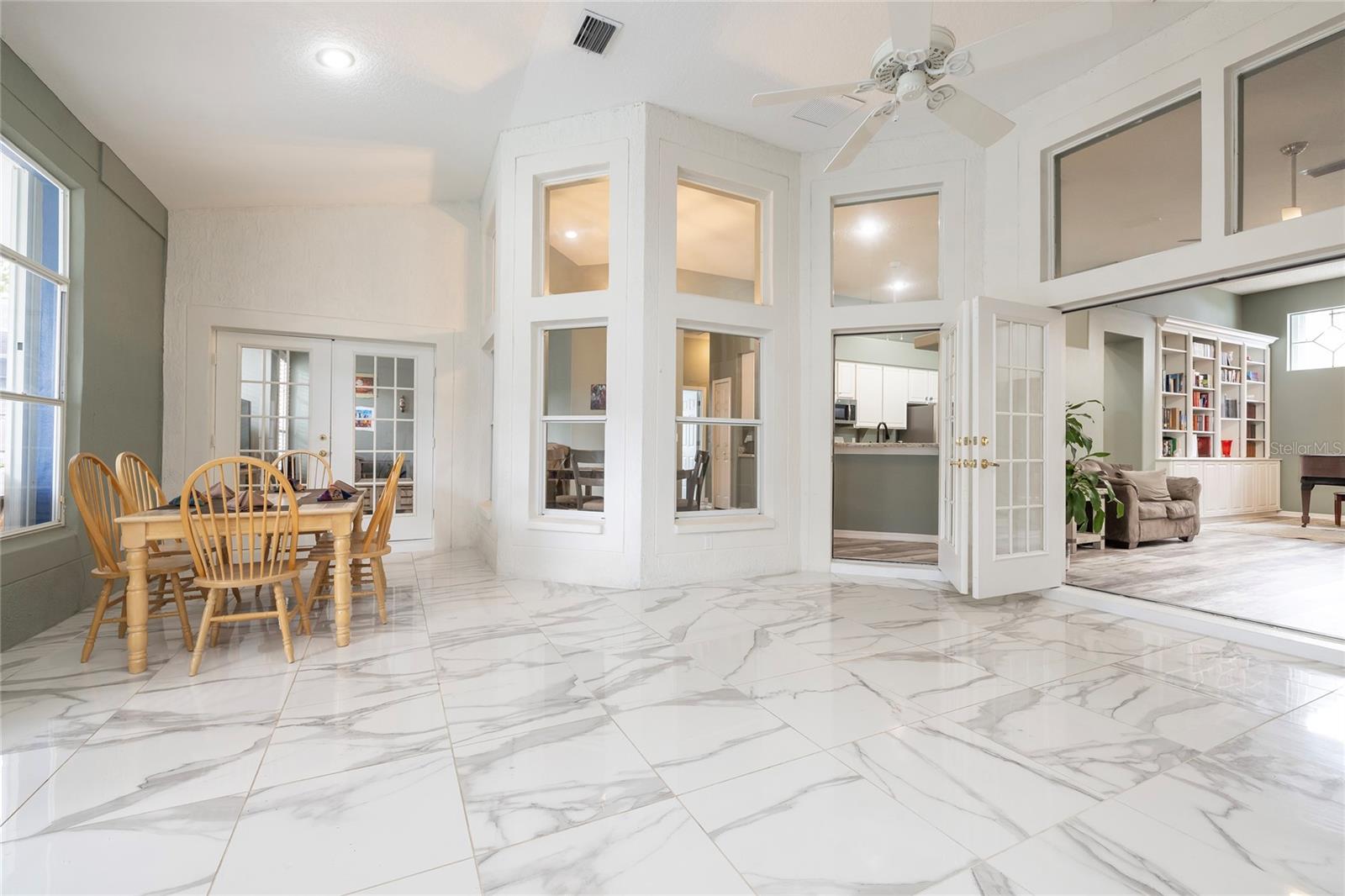 Large Open game room/hobby room overlooking the pool