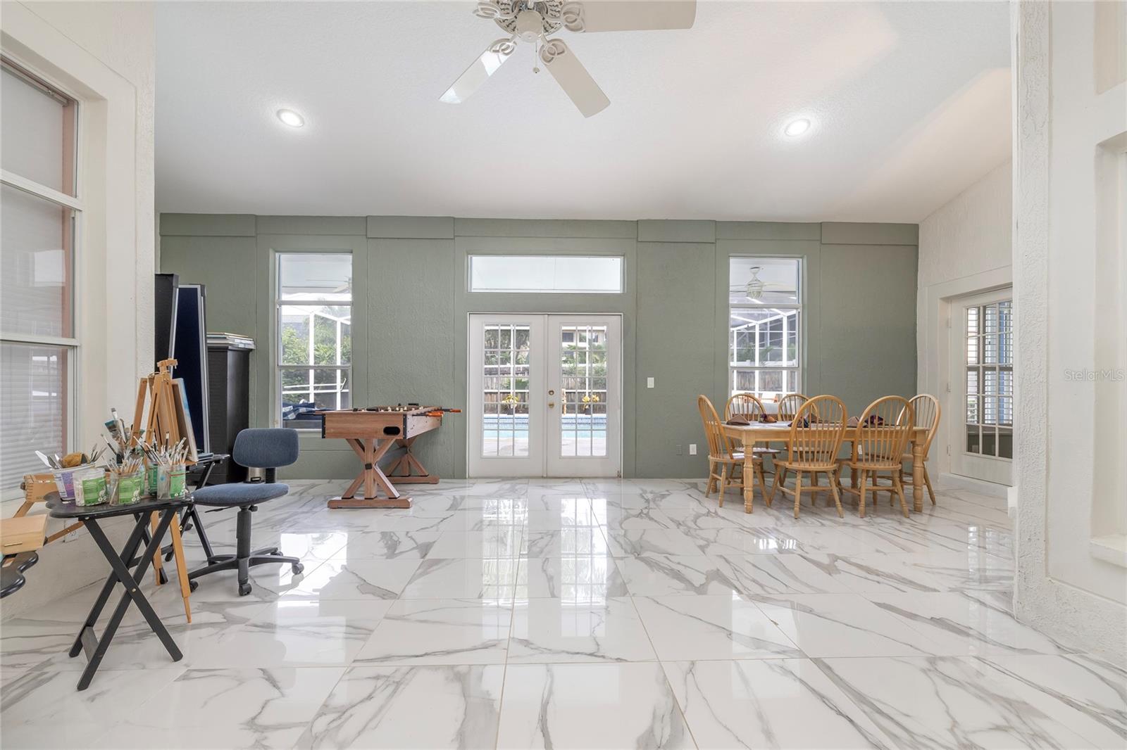 arge Open game room/hobby room overlooking the pool