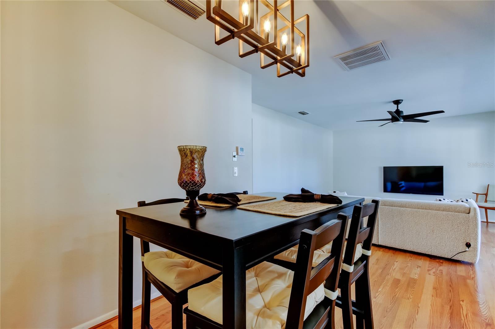 17. Dining Area (8.6' x 8.9') is Spacious Enough for a 4-Person Dinnette & Features Consistent Wood Laminate Flooring as Living Room & Hallway.