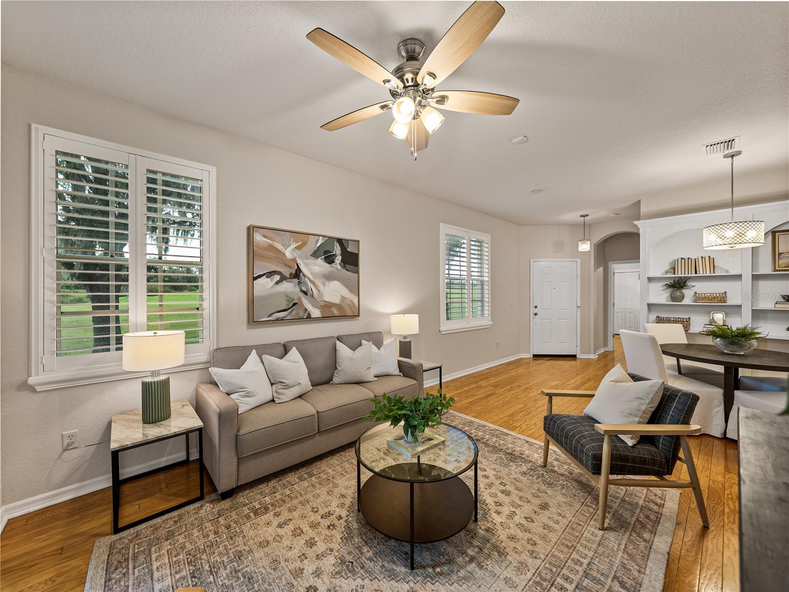 Living area and custom plantation shutters throughout the home