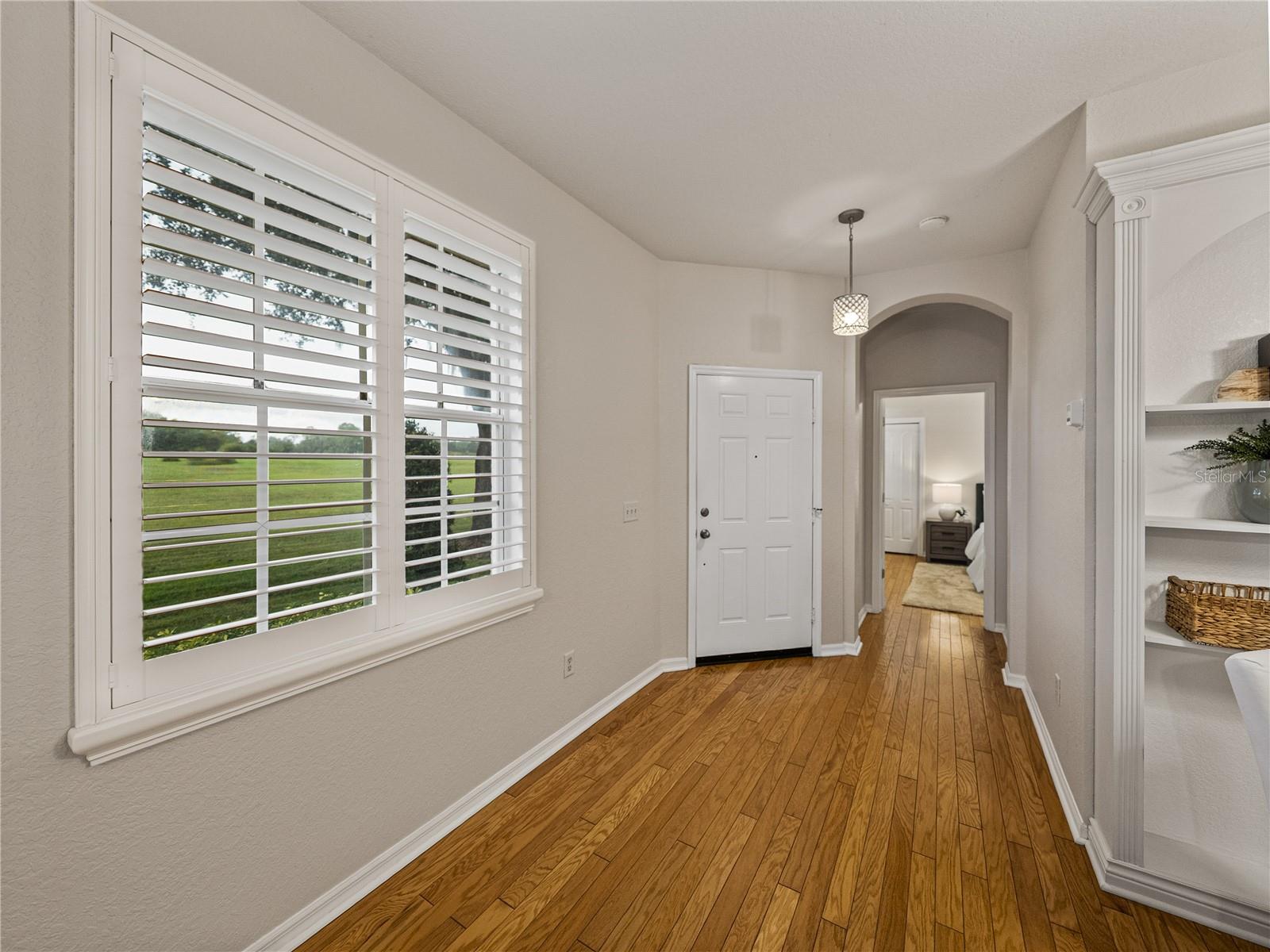 Foyer and beautiful hard2wwood floors throughout
