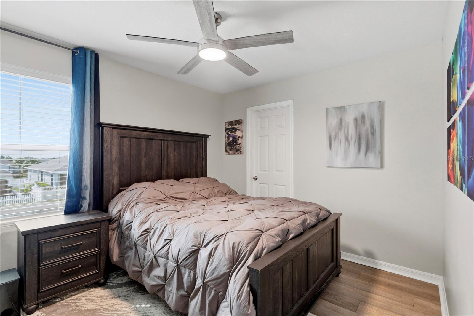 3rd bedroom with walk in closet and ceiling fan