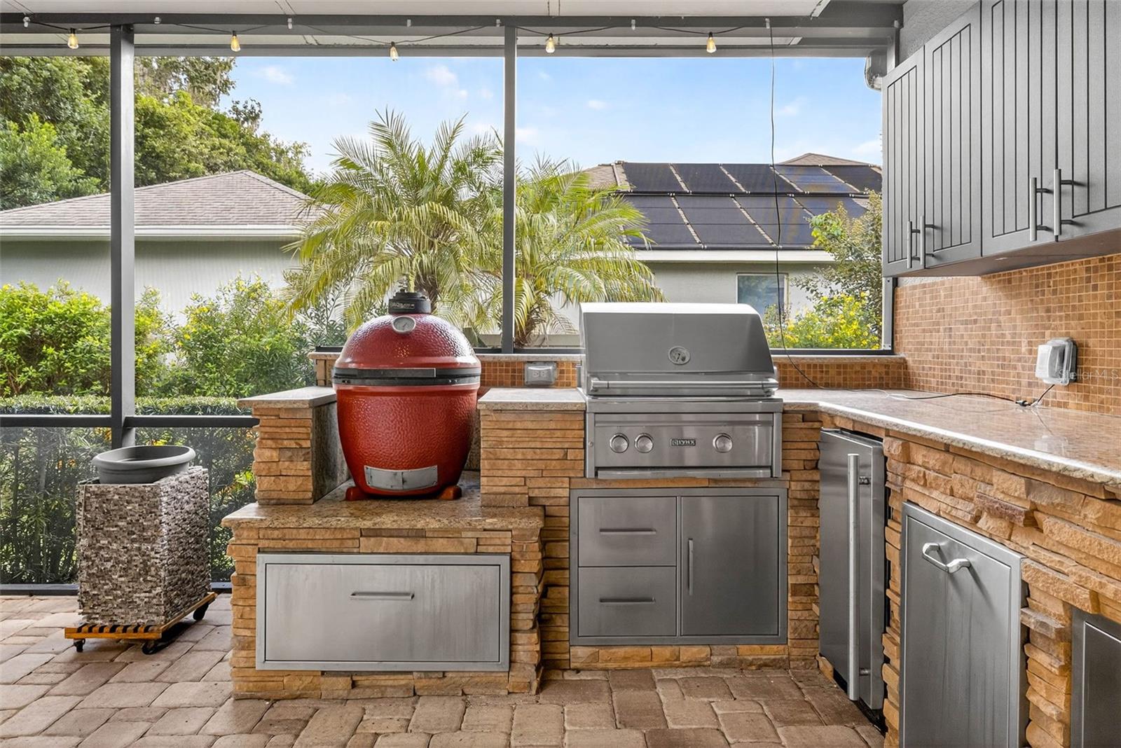 Egg Grill/Smoker, Gas Grill, Refrigerator, Trash and Storage areas with Cabinets