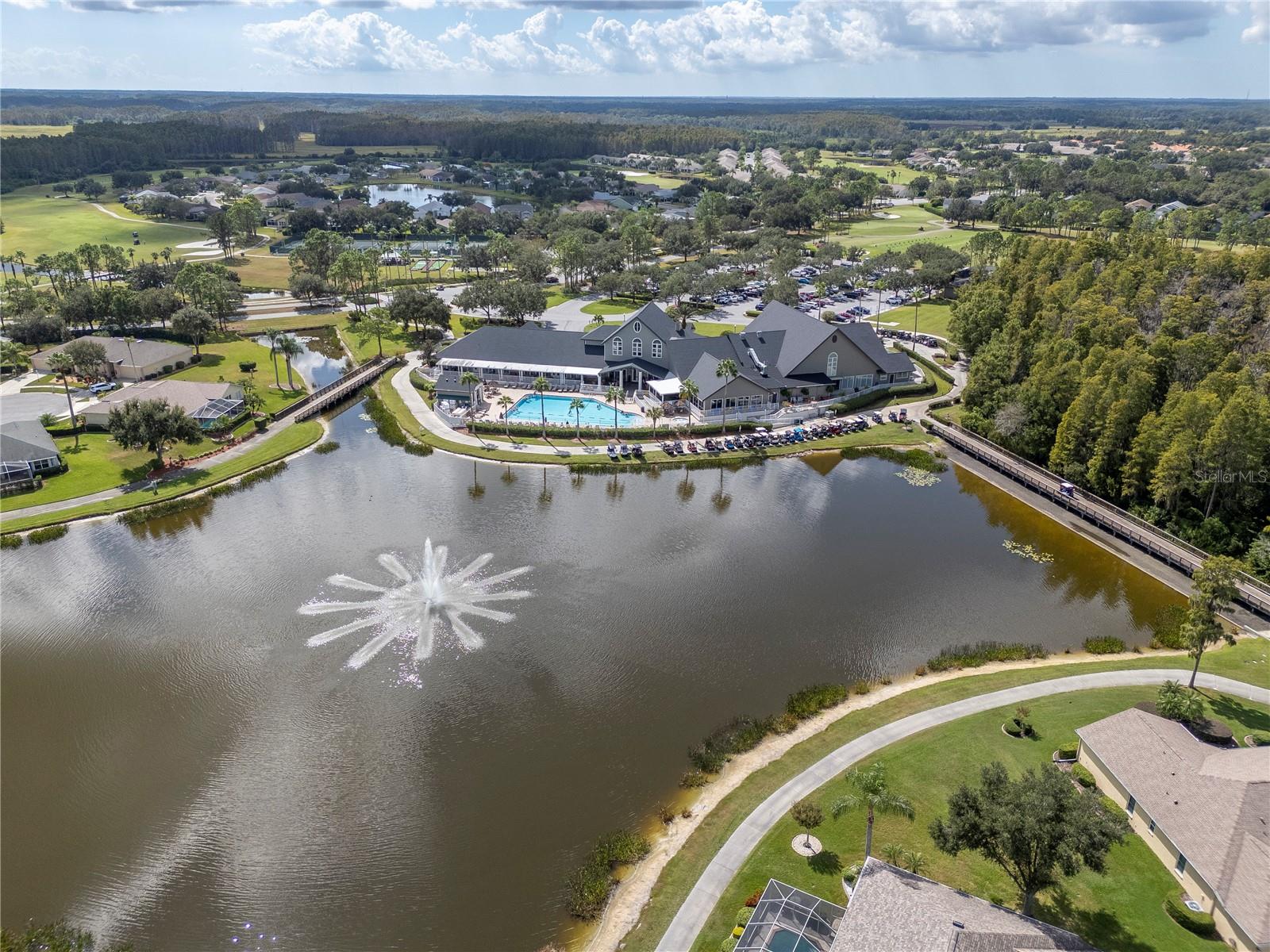 Pool and terrace overlooking lake.