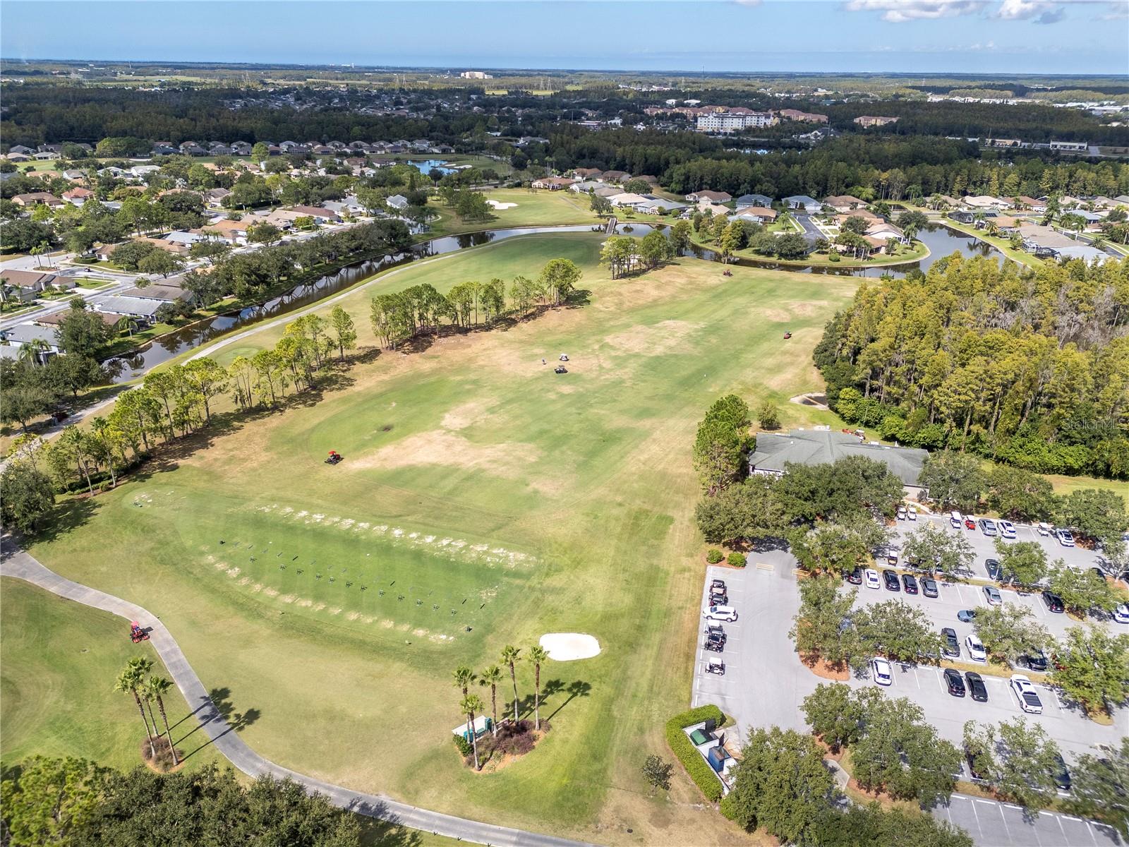 Practice facility and 1st Hole. Golf shop & fitness center right center.