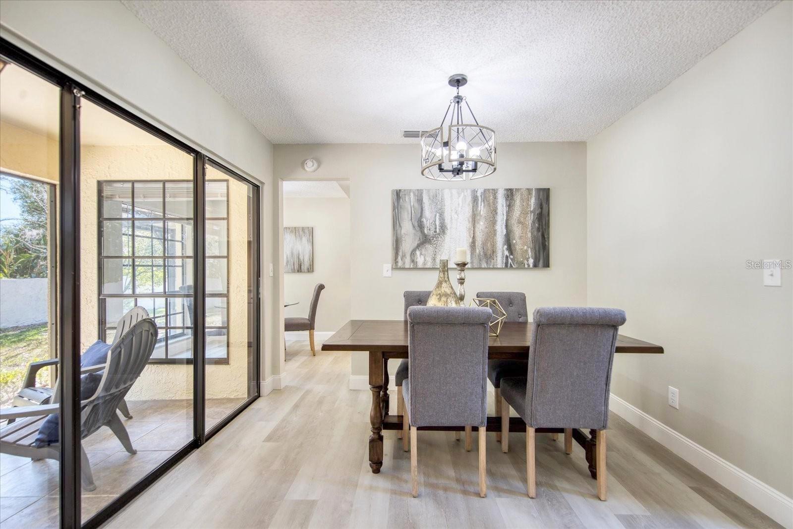 Sliding doors to the screened lanai & new ceiling fans & light fixtures through out~