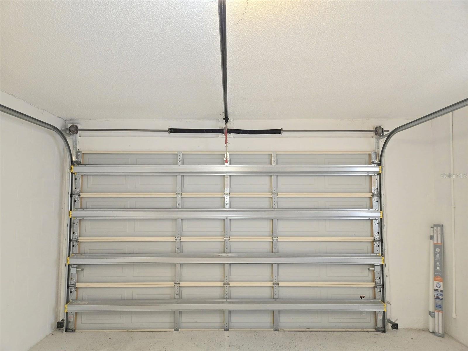 Updated garage door is hurricane rated. Genie garage door opener~