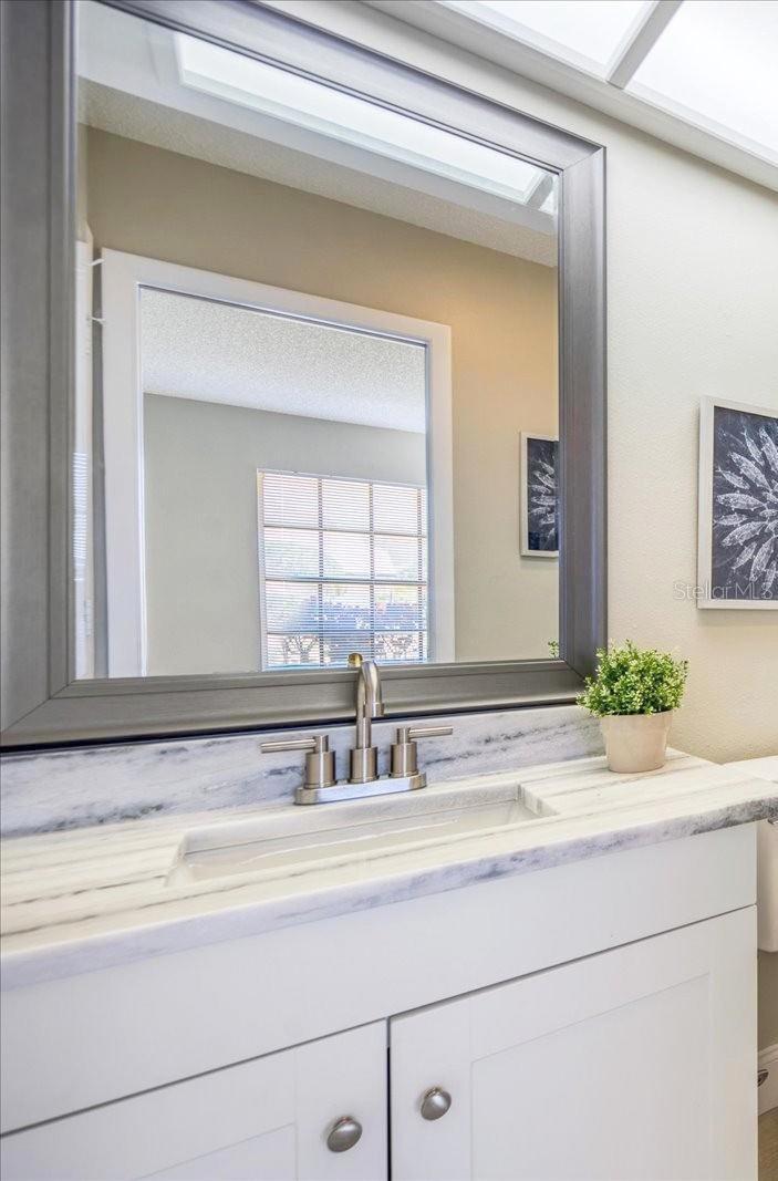 The hall bathroom has been nicely updated and also has a new Bath Fitter shower & a fancy commode~